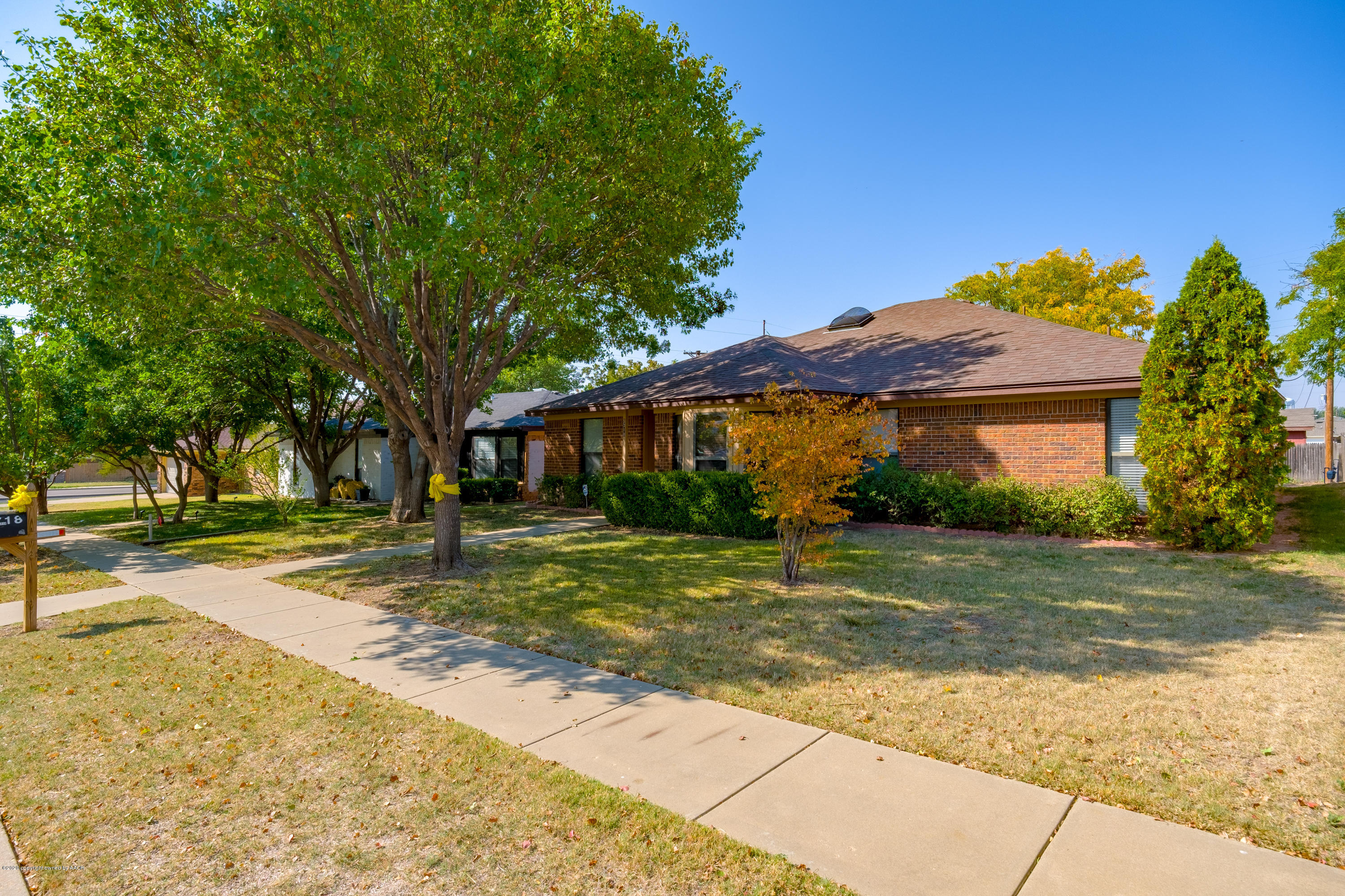 5718 South Fannin Street Amarillo, TX 79110 - Photo 3 of 31 a front view of a house with a yard