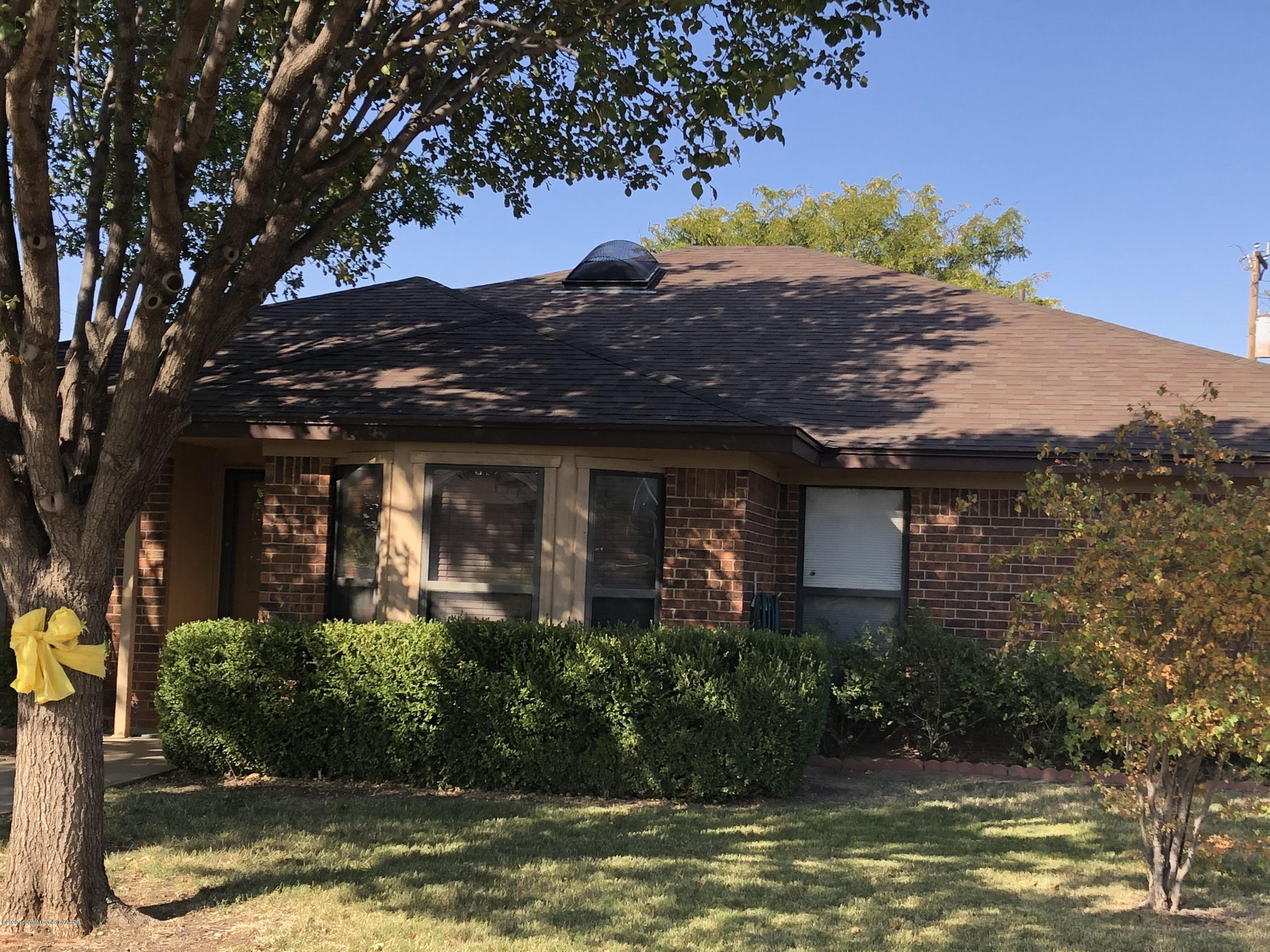 5718 South Fannin Street Amarillo, TX 79110 - Photo 31 of 31 a view of a house with a large window and a tree