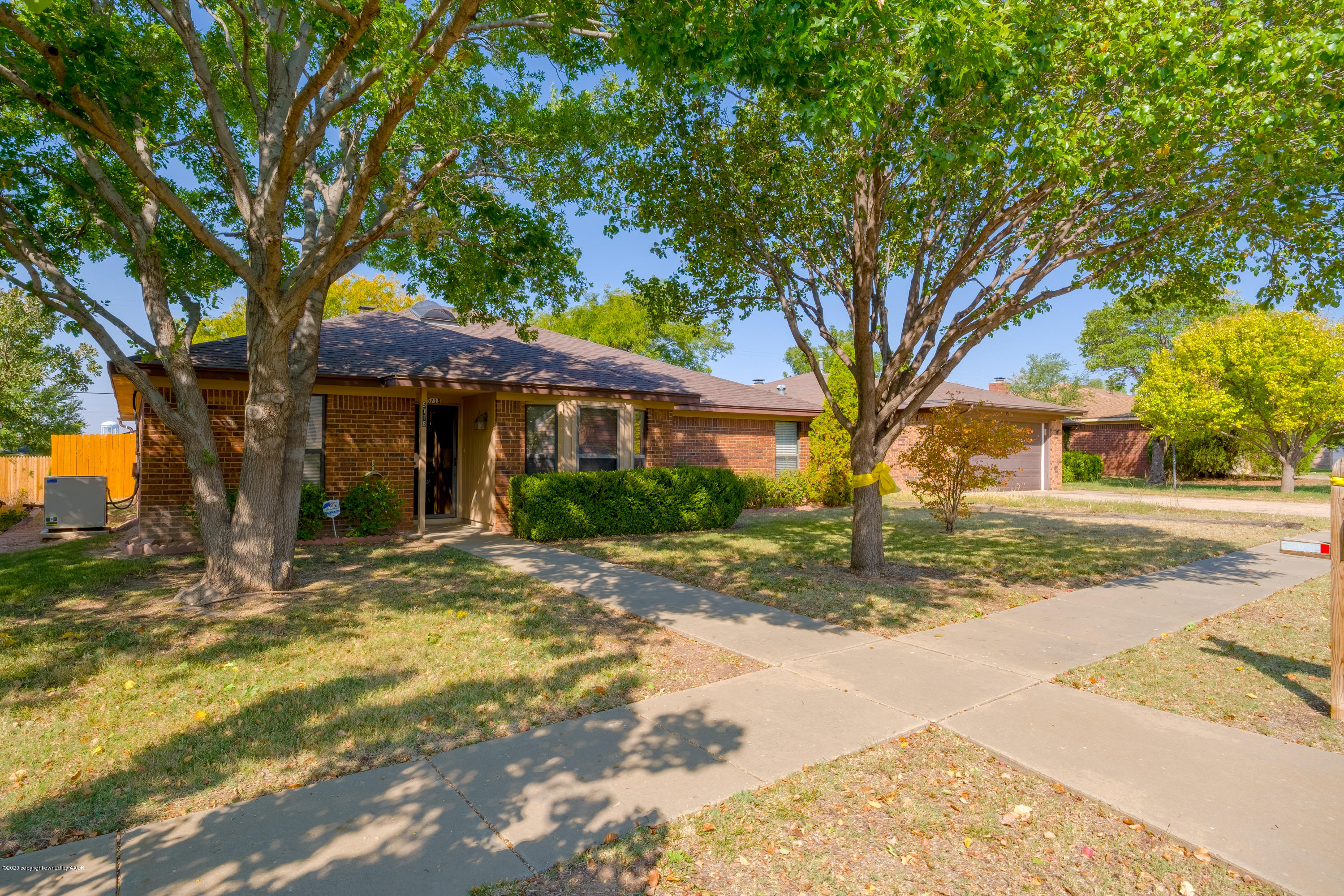 5718 South Fannin Street Amarillo, TX 79110 - Photo 4 of 31 a view of a white house next to a road and trees