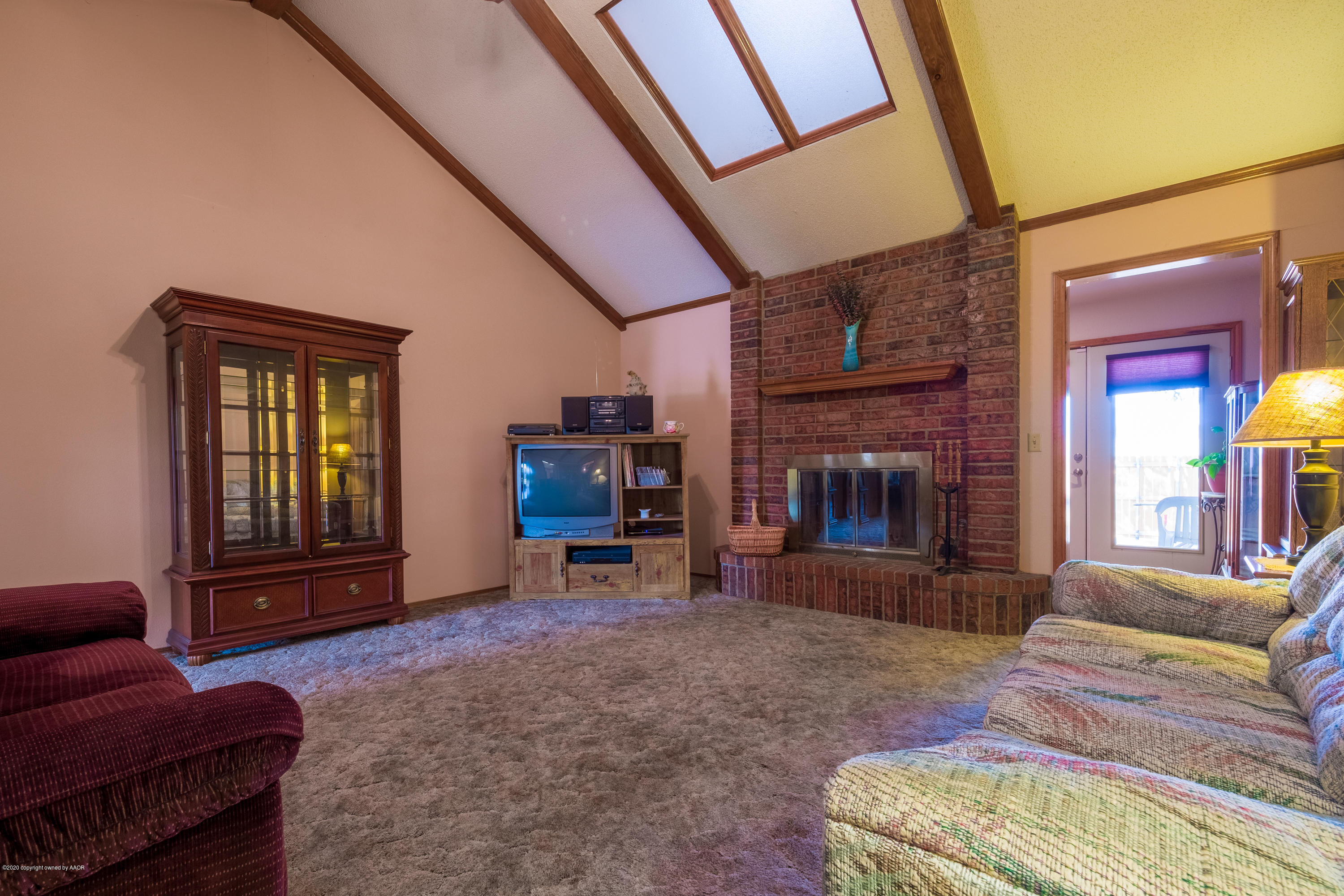 5718 South Fannin Street Amarillo, TX 79110 - Photo 6 of 31 a living room with furniture and a fireplace
