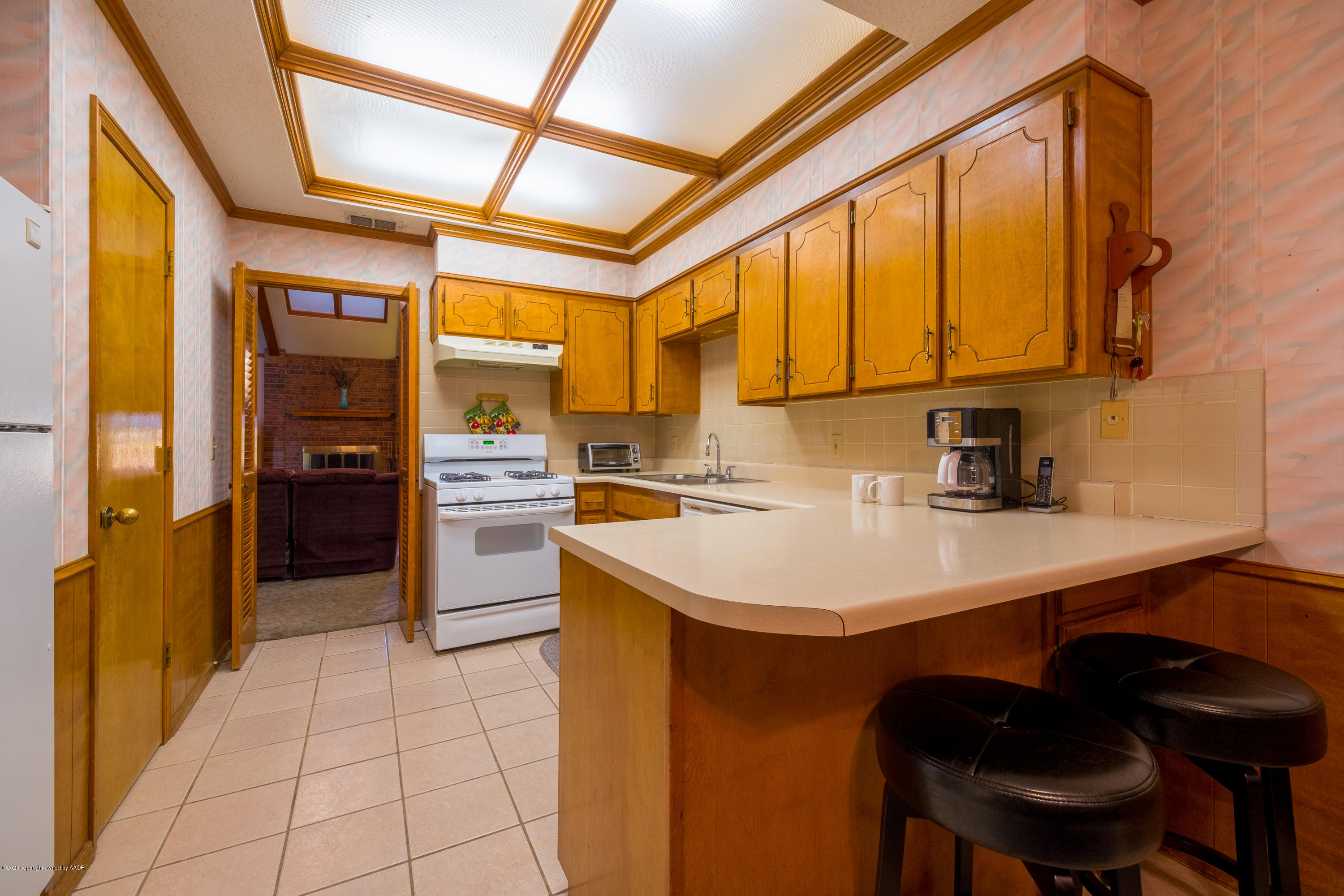 5718 South Fannin Street Amarillo, TX 79110 - Photo 10 of 31 a kitchen with a sink cabinets and appliances