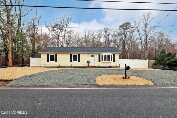 a house view with a backyard space