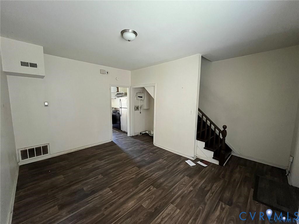 703-705 Harding Street Petersburg, VA 23803 - Photo 4 of 14 a view of an empty room with wooden floor and closet