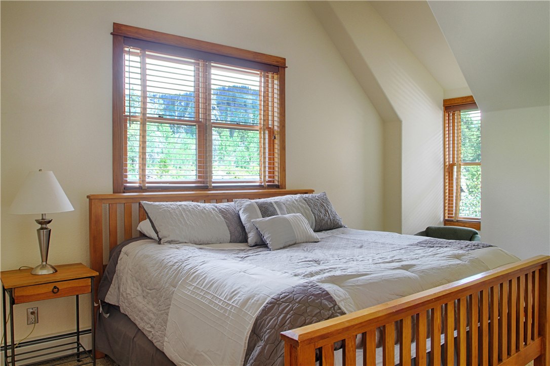 77 Antlers Gulch Road, Unit 304 Keystone, CO 80435 - Photo 8 of 25 Upper level Master Bedroom is very large with an attached bathroom, closets and even a little nook sitting area.