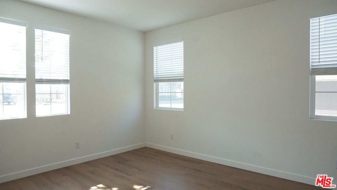 8564 Exposition Street Chino, CA 91708 - Photo 16 of 29 an empty room with windows