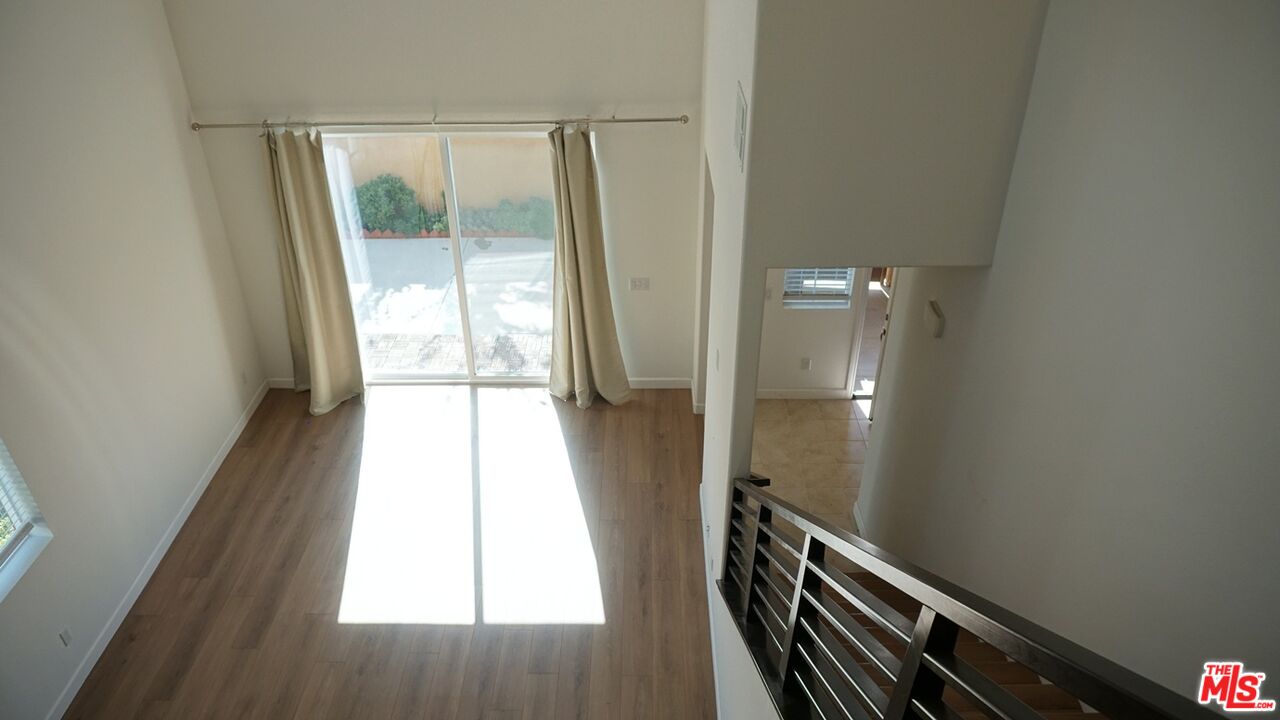 8564 Exposition Street Chino, CA 91708 - Photo 24 of 29 a view of an empty room and a window