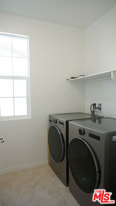 8564 Exposition Street Chino, CA 91708 - Photo 26 of 29 a utility room with dryer and washer