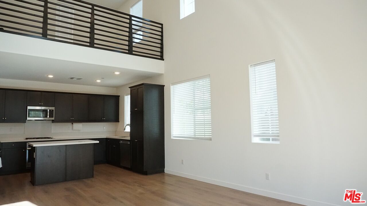 8564 Exposition Street Chino, CA 91708 - Photo 7 of 29 a kitchen with stainless steel appliances granite countertop a refrigerator and a sink