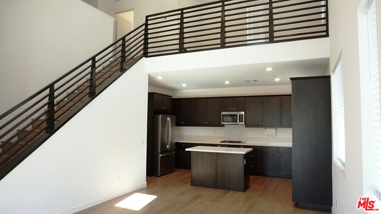 8564 Exposition Street Chino, CA 91708 - Photo 9 of 29 a view of kitchen with stainless steel appliances cabinets and oven