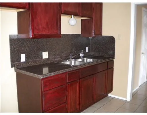 a kitchen with a stove and a refrigerator