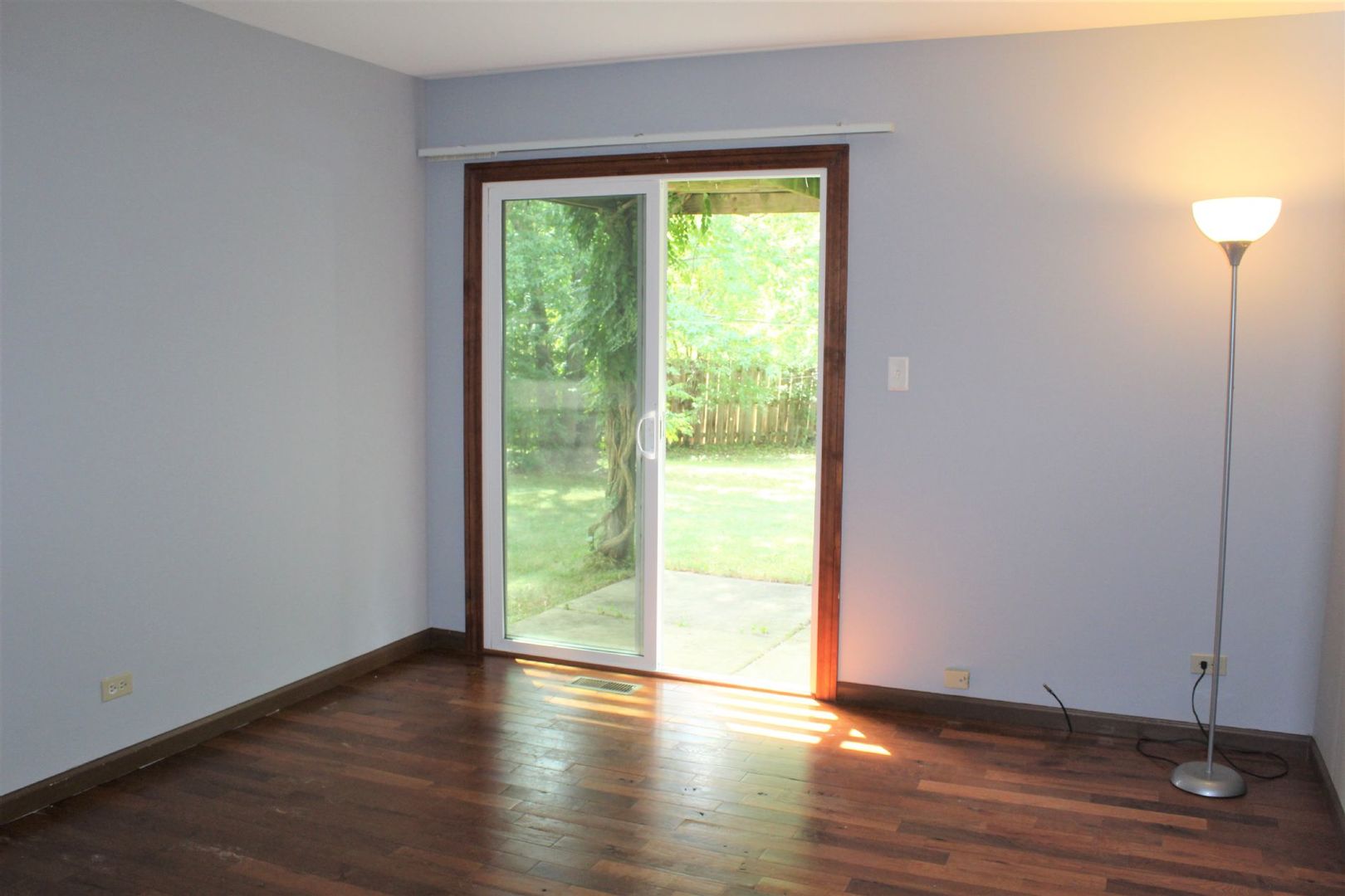 1391 Rennet Drive Naperville, IL 60565 - Photo 14 of 21 a view of an empty room with wooden floor and a window
