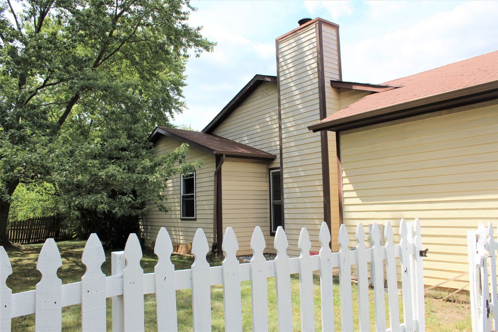 1391 Rennet Drive Naperville, IL 60565 - Photo 19 of 21 a front view of a house with wooden fence