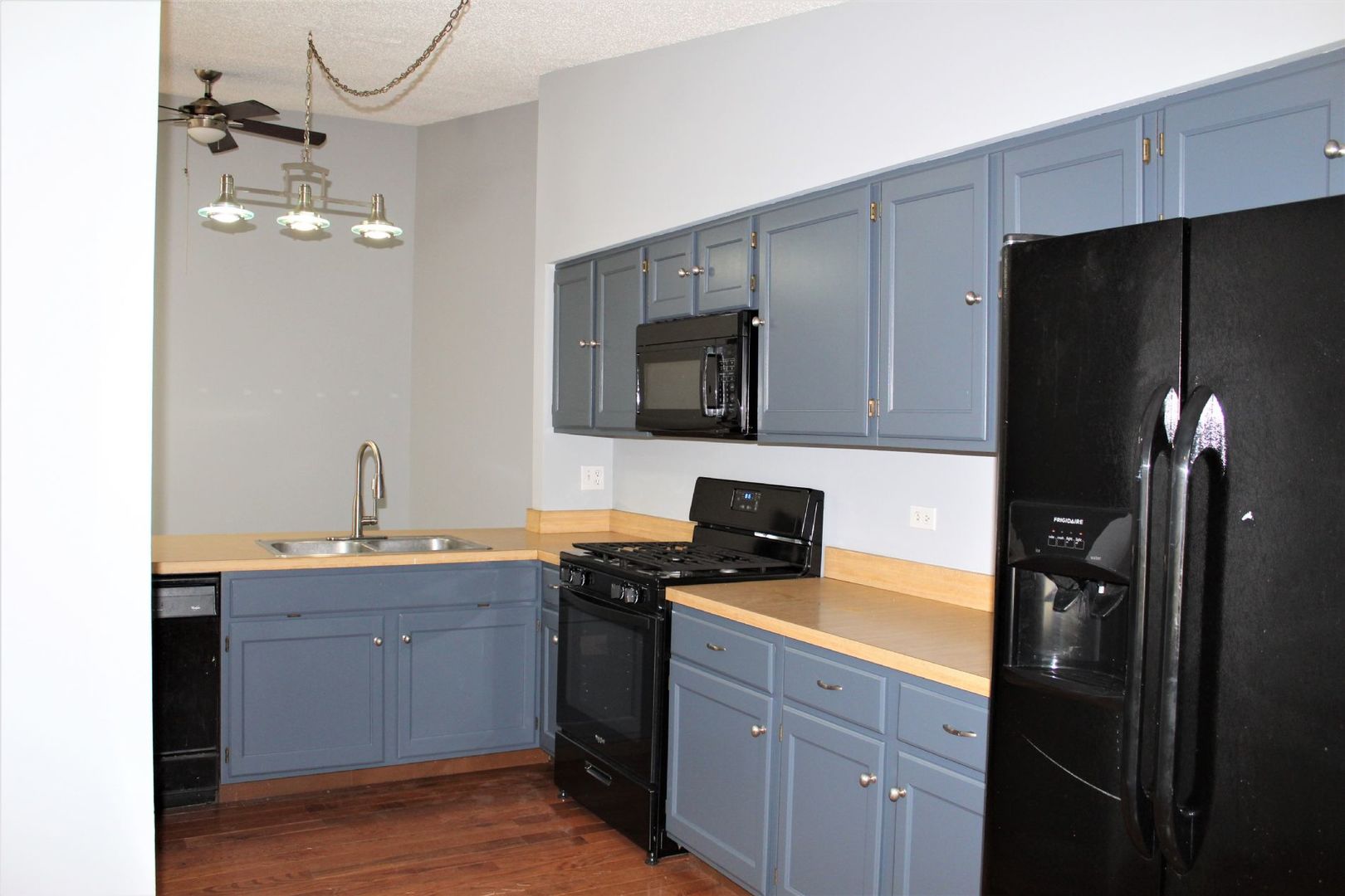 1391 Rennet Drive Naperville, IL 60565 - Photo 5 of 21 a kitchen with a sink appliances and cabinets