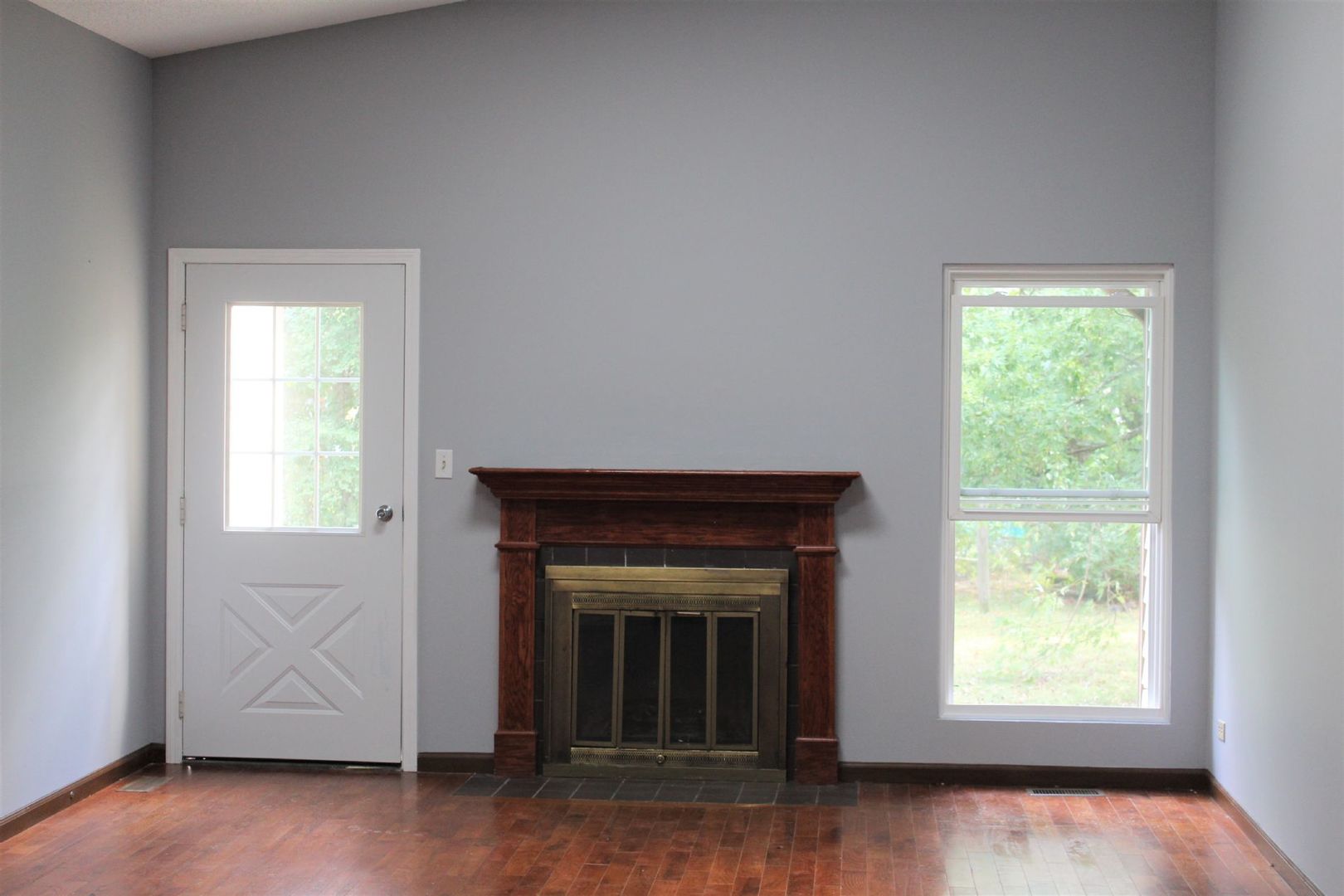 1391 Rennet Drive Naperville, IL 60565 - Photo 10 of 21 a view of an empty room with wooden floor and a window