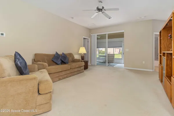 a bathroom with a granite countertop sink a toilet a mirror and shower