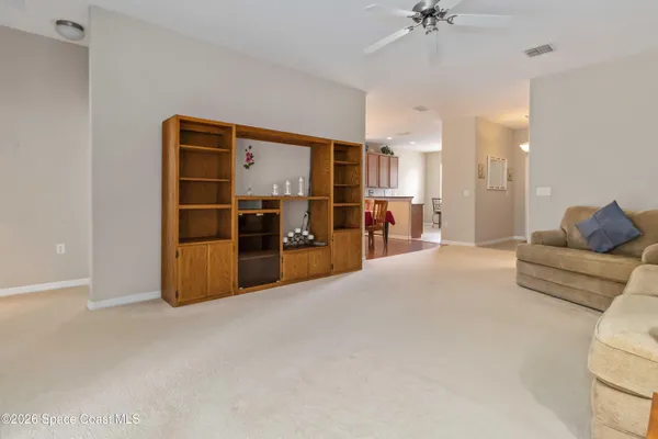 a bedroom with a bed and a chair