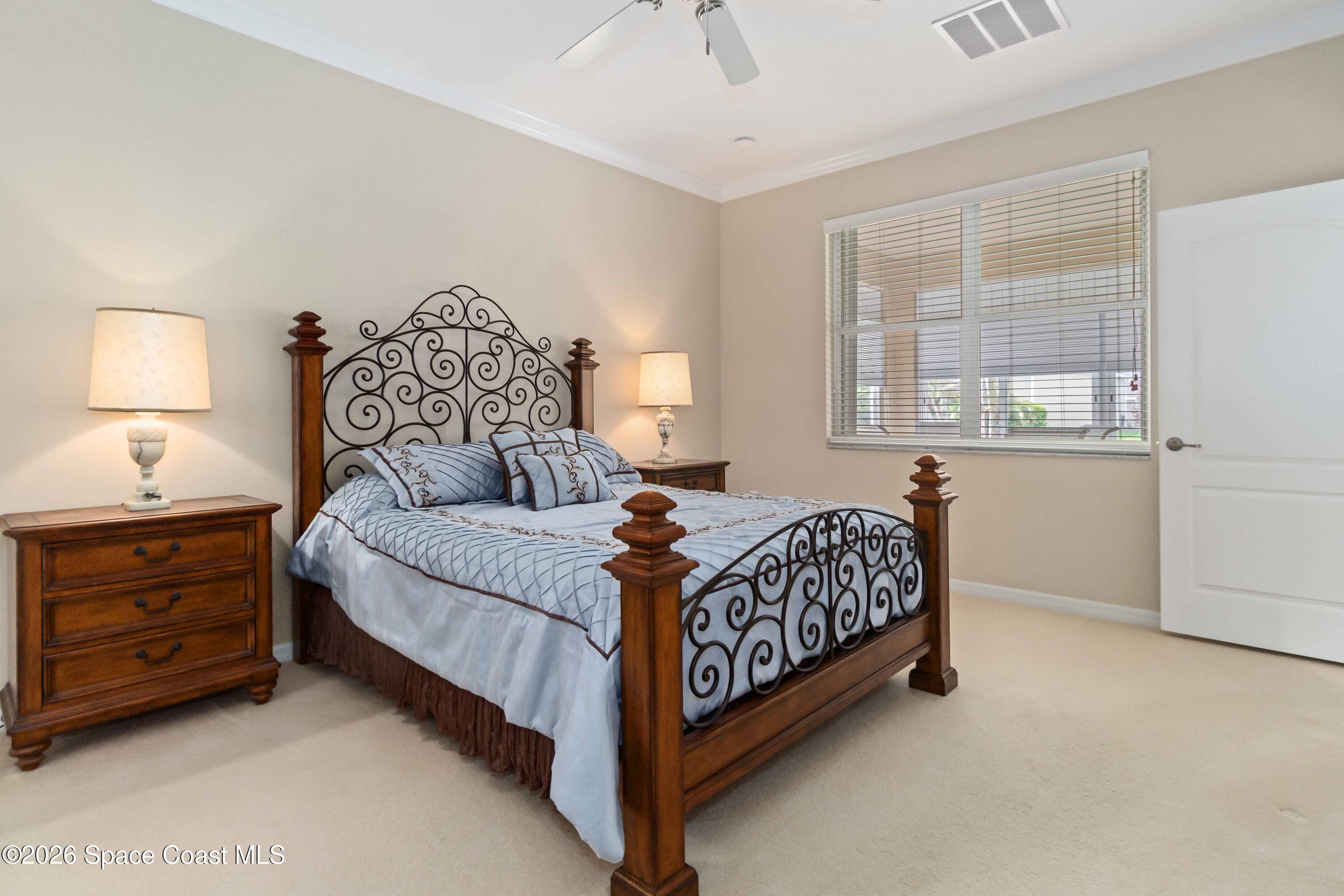 6604 Pico Street Melbourne, FL 32940 - Photo 15 of 36 a bedroom with a bed and a window