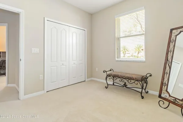 a view of a swimming pool with a lounge chair