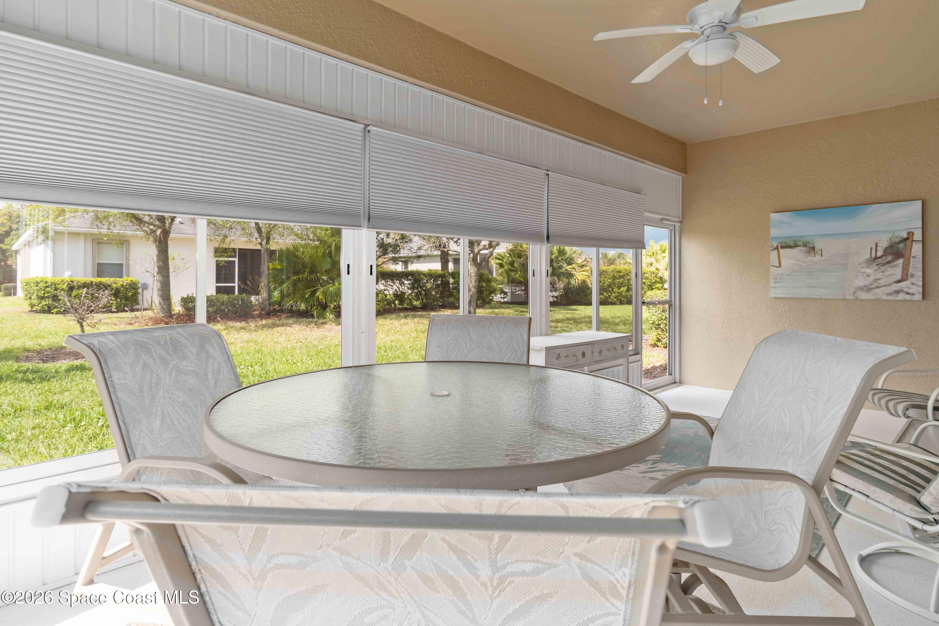 6604 Pico Street Melbourne, FL 32940 - Photo 21 of 36 a view of a dining room with furniture wooden floor and chandelier