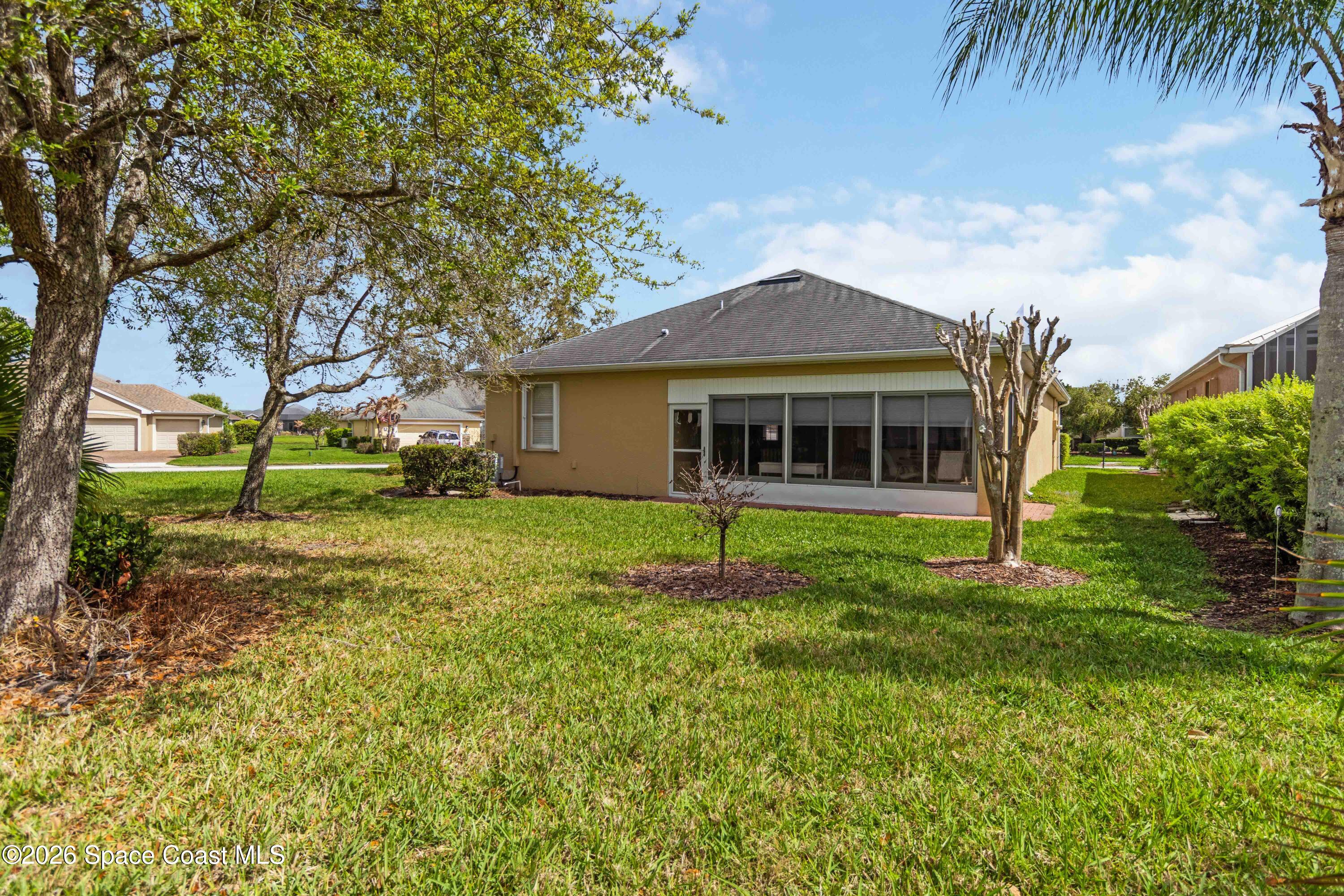 6604 Pico Street Melbourne, FL 32940 - Photo 22 of 36 front view of a house with a yard