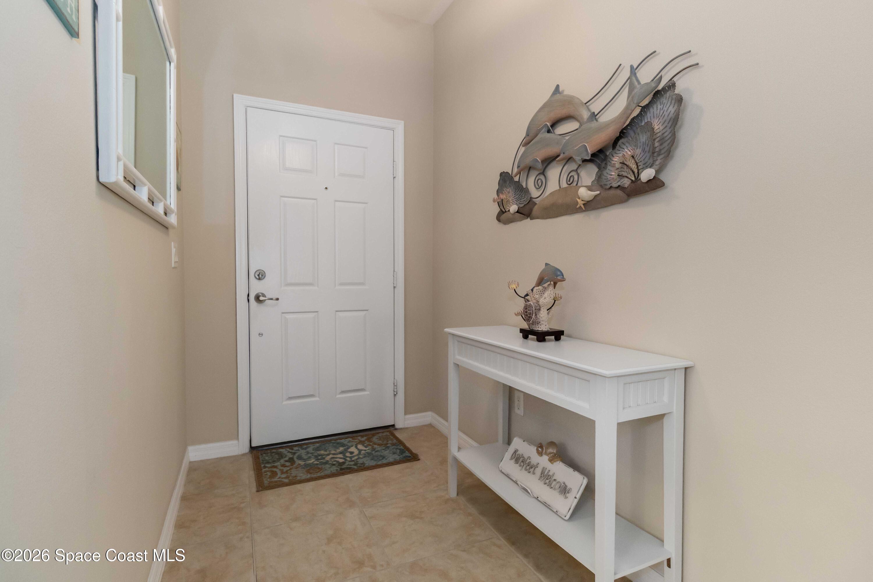 6604 Pico Street Melbourne, FL 32940 - Photo 7 of 36 a room with a sink and a mirror