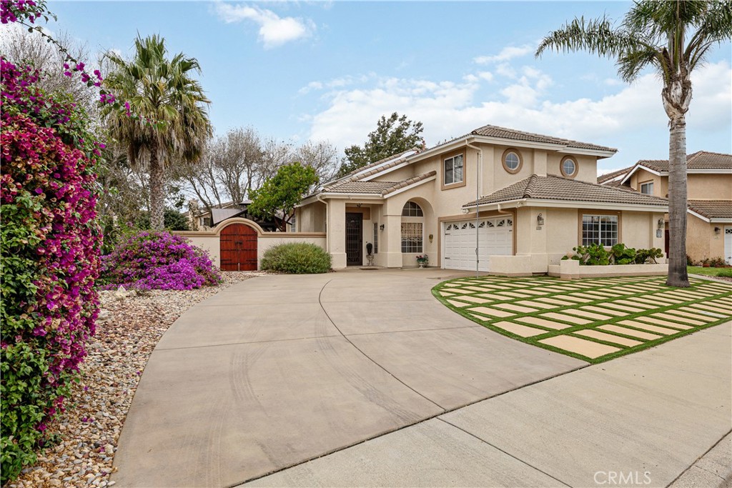 1320-1320 Stonebrook Drive Lompoc, CA 93436 - Photo 2 of 72 a front view of a house with garden