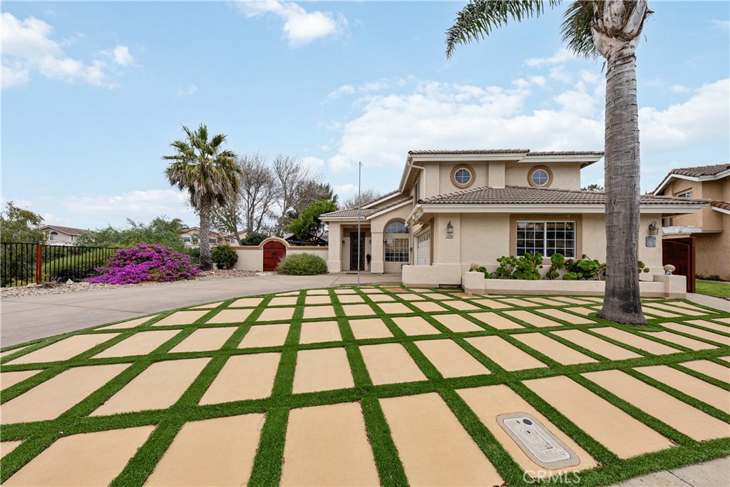 1320-1320 Stonebrook Drive Lompoc, CA 93436 - Photo 3 of 72 a front view of a house with a yard