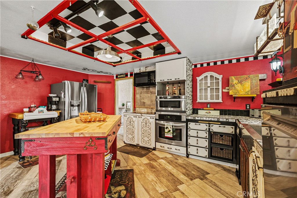 1320-1320 Stonebrook Drive Lompoc, CA 93436 - Photo 33 of 72 a open kitchen with stainless steel appliances kitchen island granite countertop a stove and a refrigerator