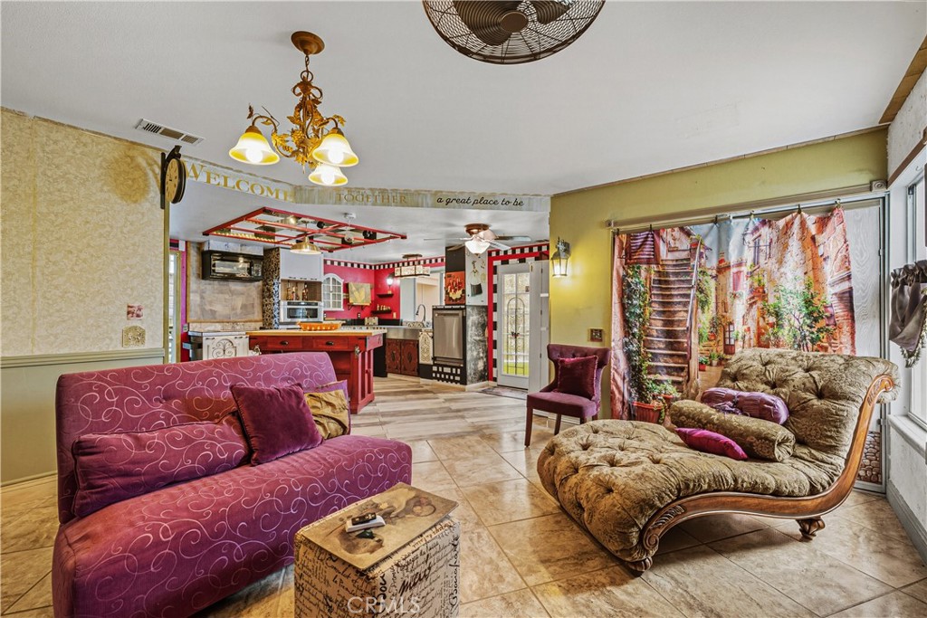 1320-1320 Stonebrook Drive Lompoc, CA 93436 - Photo 37 of 72 a living room with furniture a couch and a chandelier