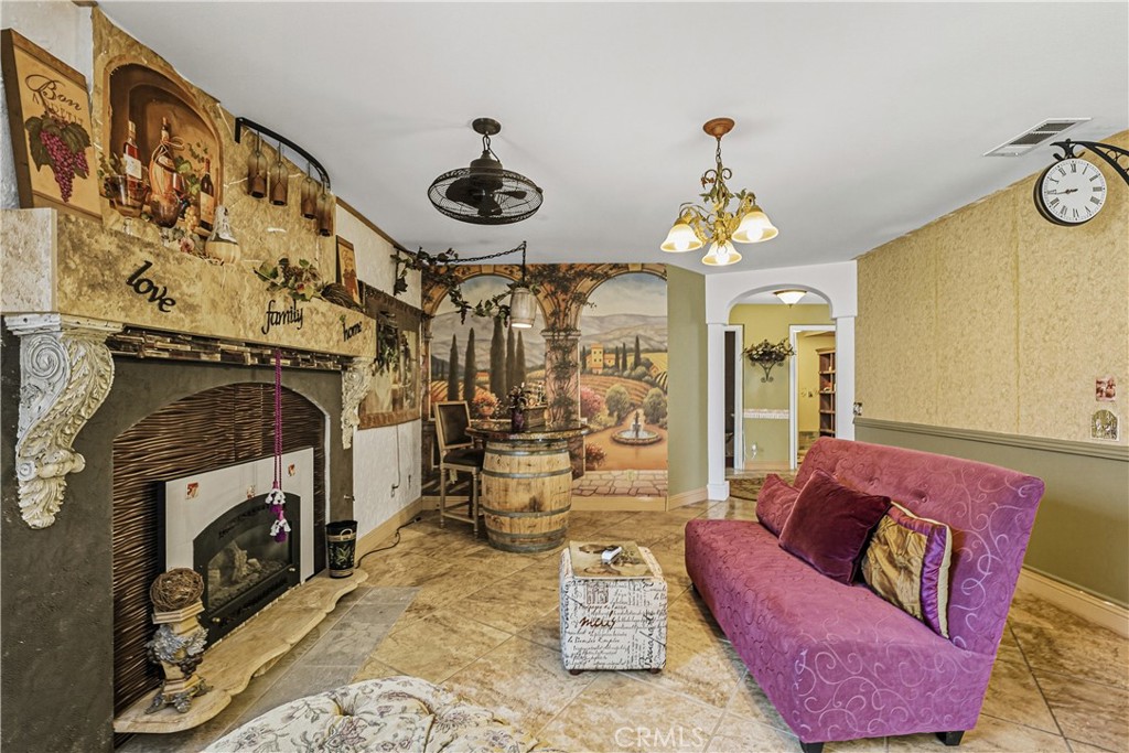 1320-1320 Stonebrook Drive Lompoc, CA 93436 - Photo 39 of 72 a living room with furniture and a fireplace