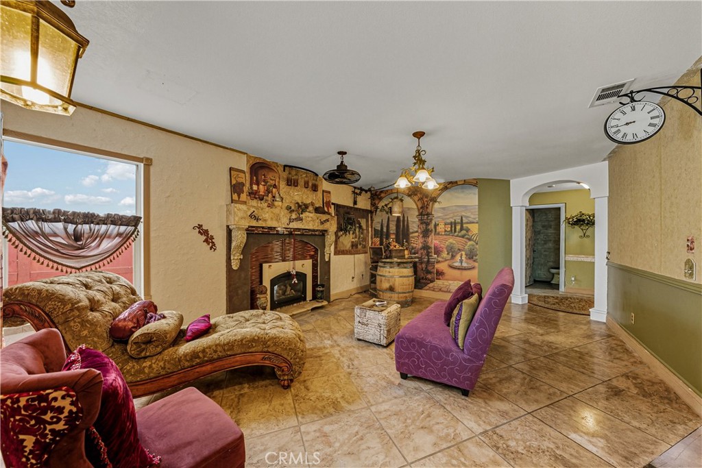 1320-1320 Stonebrook Drive Lompoc, CA 93436 - Photo 40 of 72 a bedroom with furniture and a chandelier