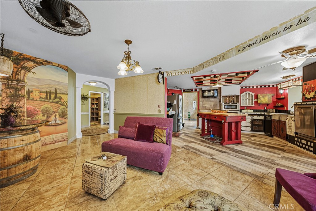 1320-1320 Stonebrook Drive Lompoc, CA 93436 - Photo 41 of 72 a living room with furniture a flat screen tv and a table