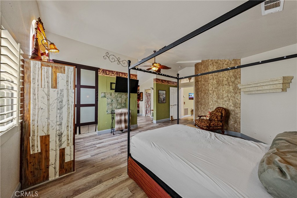 1320-1320 Stonebrook Drive Lompoc, CA 93436 - Photo 43 of 72 a bedroom with a bed window and a wooden floor