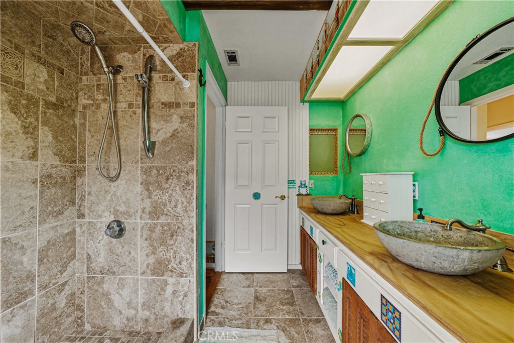 1320-1320 Stonebrook Drive Lompoc, CA 93436 - Photo 55 of 72 a bathroom with a granite countertop sink and a mirror
