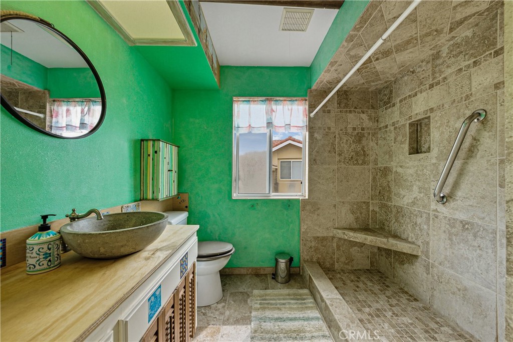 1320-1320 Stonebrook Drive Lompoc, CA 93436 - Photo 56 of 72 a bathroom with a sink and mirror