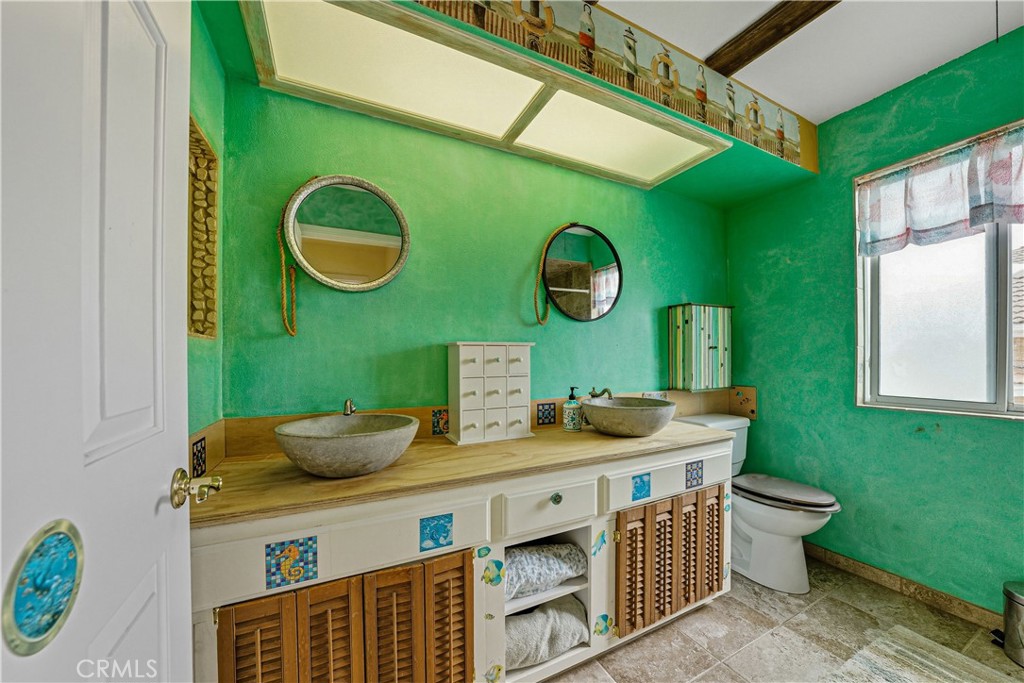 1320-1320 Stonebrook Drive Lompoc, CA 93436 - Photo 57 of 72 a bathroom with a sink and a mirror