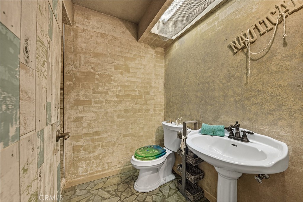 1320-1320 Stonebrook Drive Lompoc, CA 93436 - Photo 59 of 72 a bathroom with a toilet sink and a shower