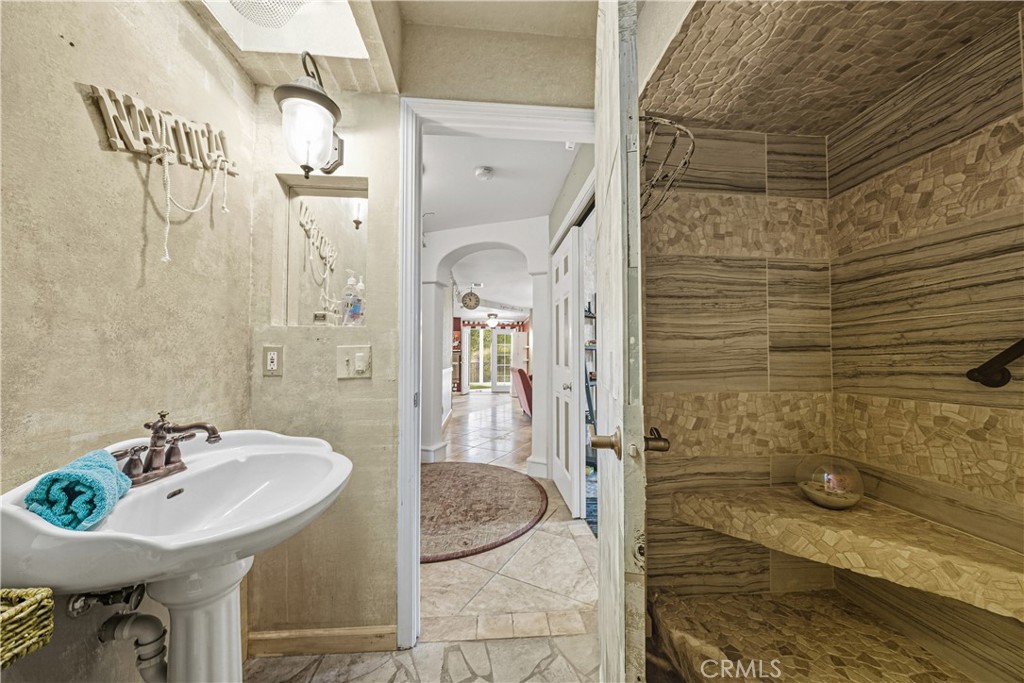 1320-1320 Stonebrook Drive Lompoc, CA 93436 - Photo 60 of 72 a bathroom with a sink and a mirror