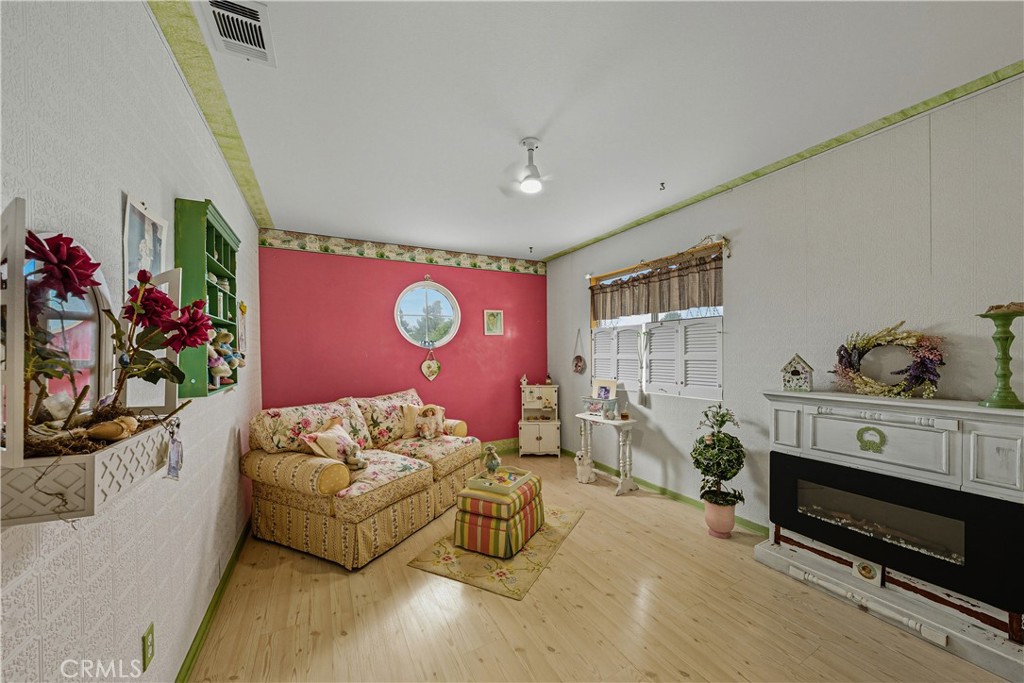 1320-1320 Stonebrook Drive Lompoc, CA 93436 - Photo 63 of 72 a living room with furniture and a flat screen tv