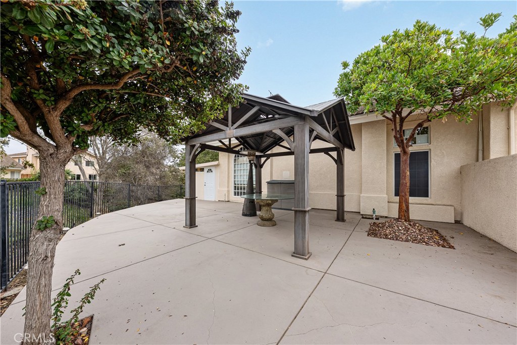 1320-1320 Stonebrook Drive Lompoc, CA 93436 - Photo 69 of 72 a view of a patio with table and chairs and potted plants