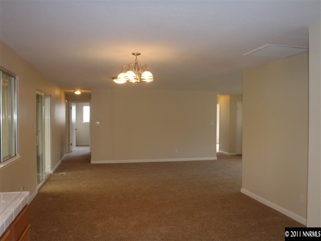 525 Nancy Circle Reno, NV 89503 - Photo 3 of 12 a view of an empty room with a chandelier fan