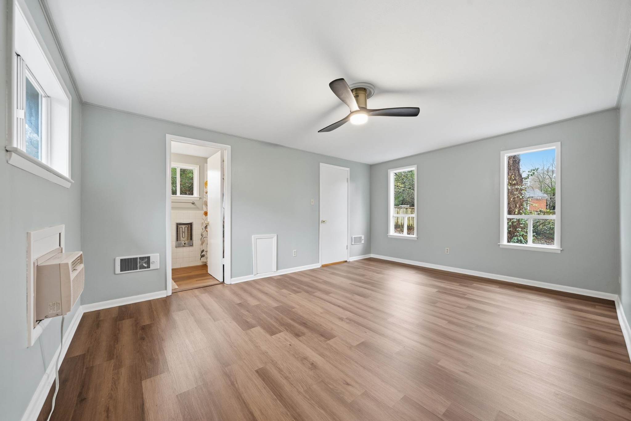 2534 Elmore Park Road Memphis, TN 38134 - Photo 18 of 35 a view of empty room with wooden floor and fan