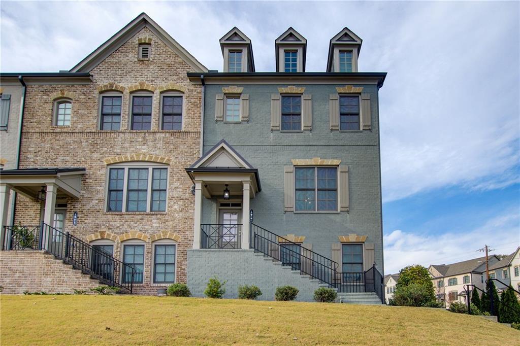 a front view of a house with a yard