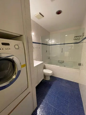 a bathroom with a bathtub and shower