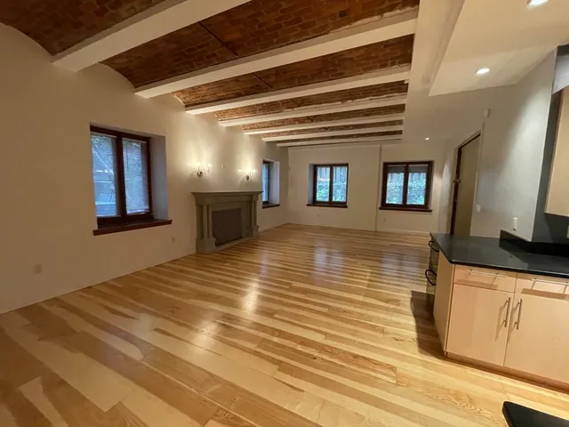 a view of a kitchen with a sink and a microwave