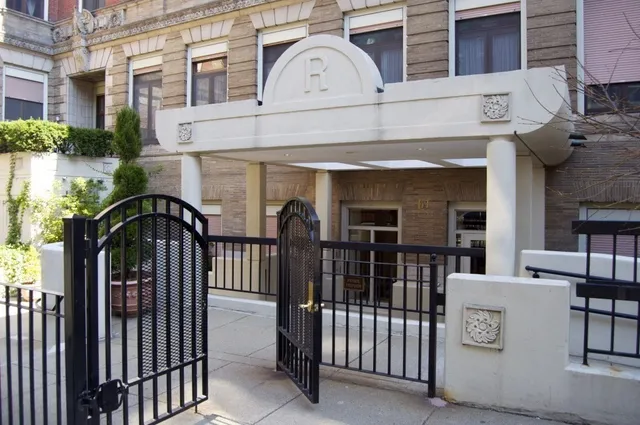 a view of a brick building with a balcony