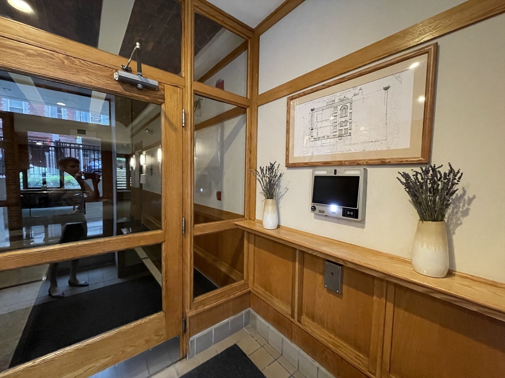 61 Prince Street, Unit 1C Boston, MA 02113 - Photo 24 of 26 a view of a living room with a large window and furniture