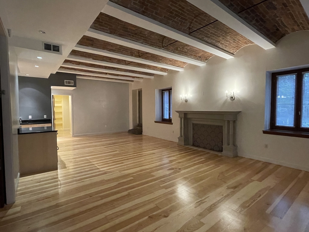 61 Prince Street, Unit 1C Boston, MA 02113 - Photo 3 of 26 a view of a livingroom with a fireplace