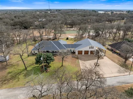 a view of a town with mountains in the background
