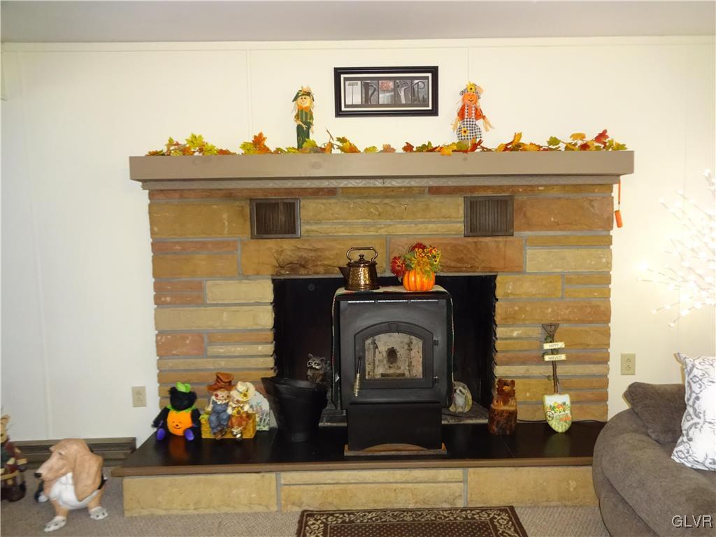 575 School Road Nazareth, PA 18064 - Photo 13 of 48 a living room with furniture and a fireplace